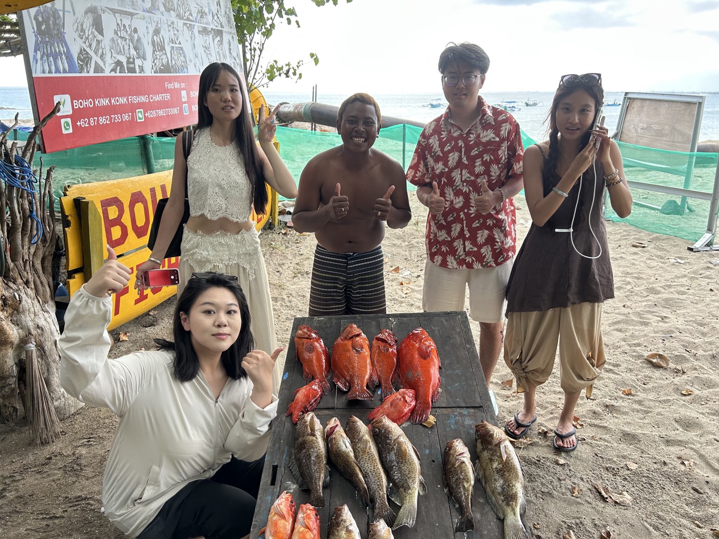 Guests with the days catch — Boho Kink Konk fishing charter, Kuta Bali